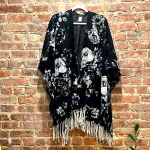 Black, grey, and white poncho. Fancy and lightweight.